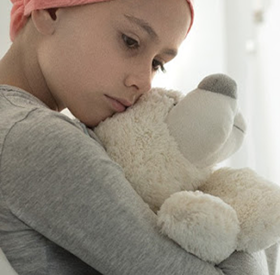A child holding a teddy bear